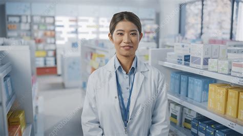 Pharmacist wearing a white coat - Stock Image - F033/2216 - Science ...