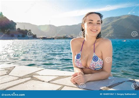Pretty Brunette Posing In The Water Stock Image Image Of Icmeler Girl
