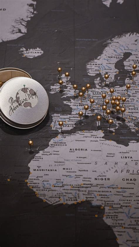 Elegant Black Map Of The World With Gold Push Pins For Travelers