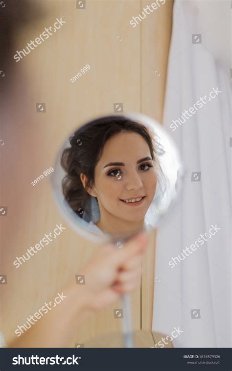 Beautiful Woman Looking Herself Mirror Stock Photo 1616579326