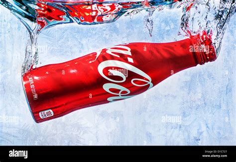 Coke Bottle Splash In Cold Water Stock Photo Alamy