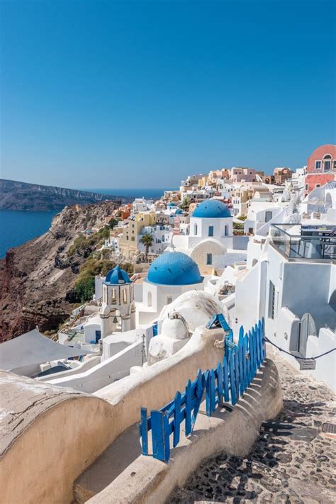 View Of Oia Town With Traditional And Famous Houses And Churches With