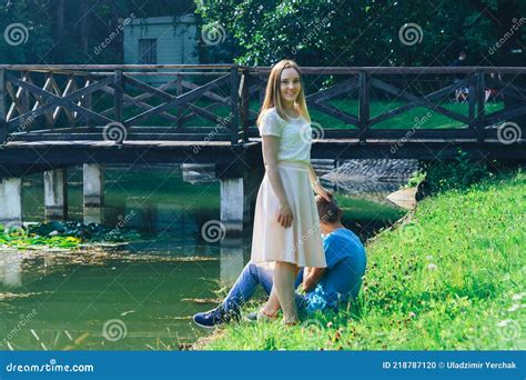 A Couple In Love Walks By The Lake In The Park On A Sunny Daya Happy