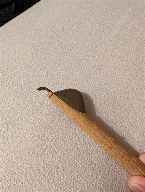 Hand Held Tool With Wooden Handle And Hook Like Scraper With An Open