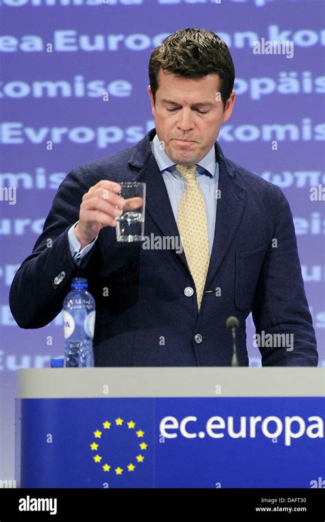 Former Defence Minister Karl-Theodor zu Guttenberg drinks during a ...