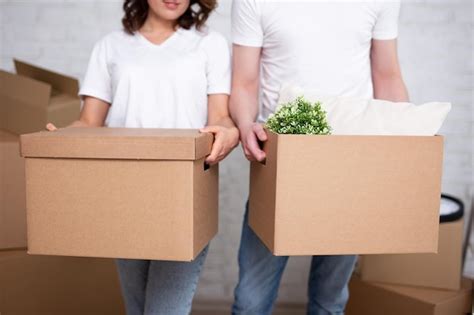 Premium Photo Moving Day Concept Close Up Of Cardboard Boxes In Young