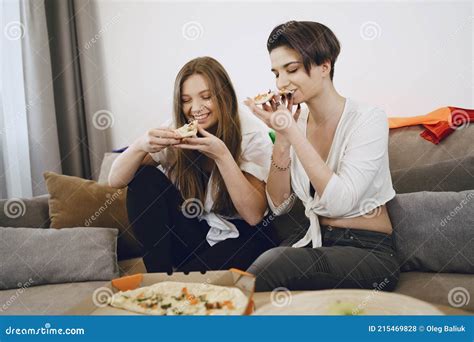Two Lesbian Girls Eating Pizza At Home Stock Photo Image Of Laughing Meal 215469828