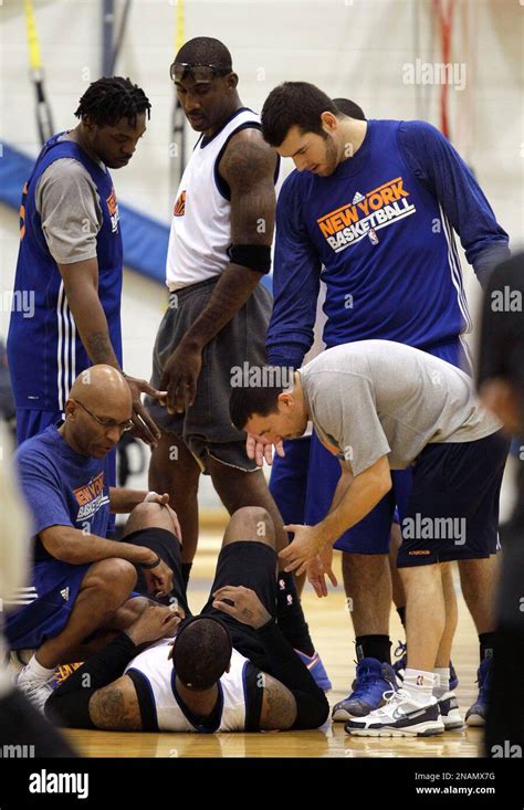 New York Knicks Forward Amare Stoudemire Standing Center Looks On As