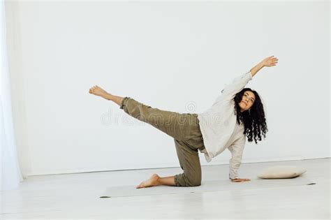 Beautiful Woman Brunette Engaged In Yoga Asana Gymnastics Flexibility