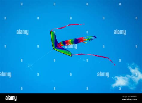 Colorful Kite Flying High In Blue Sky Stock Photo Alamy