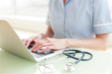 Nurse Using A Laptop Computer Photograph By Ian Hooton Science Photo