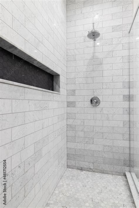 A Large Luxury Shower With Marble Subway Tile Walls Marble Hexagon