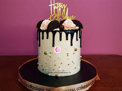 Oreo Chocolate Drip Cake With Pink Flowers And Gold Pearls