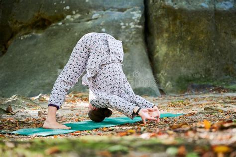 Woman Practicing Yoga Outdoors In Forest Barefoot Female On Yoga Mat