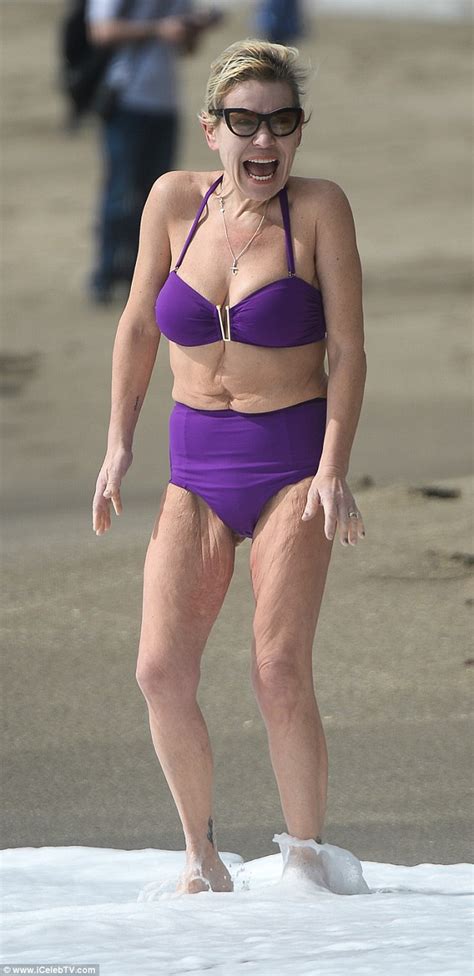 Tina Malone 54 Hits The Beach In Purple Bikini Daily Mail Online