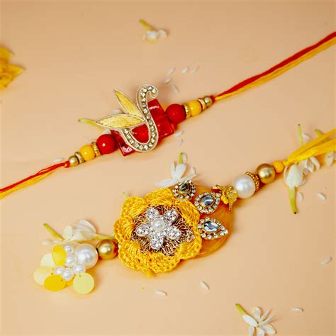 Buy Fida Handmade Yellow Red Kundan With Pearl Studded Lumba Rakhi With