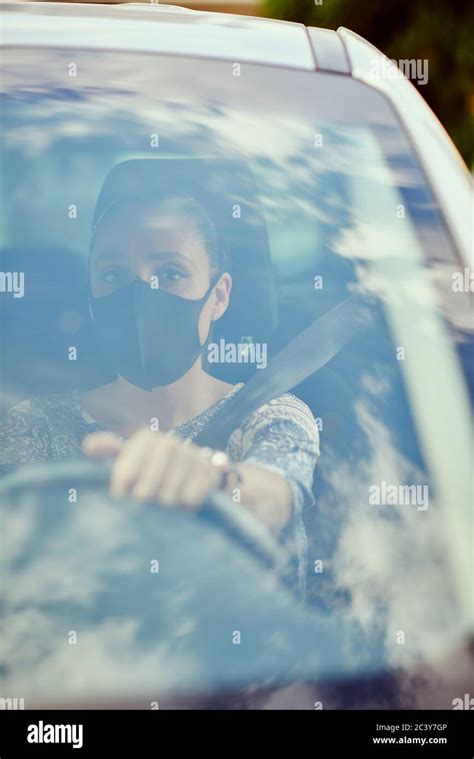 Woman With Face Mask Driving Car Stock Photo Alamy