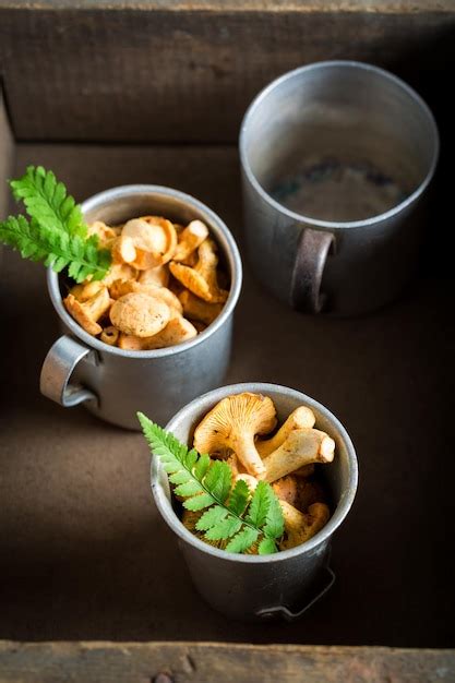 Premium Photo Fresh Mushrooms On Old Wooden Rustic Background