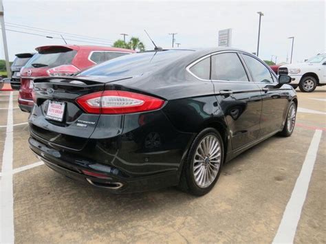 Pre Owned 2014 Ford Fusion Titanium Sedan 4 Dr In Bay City 9941a Reliance Chevrolet Gmc