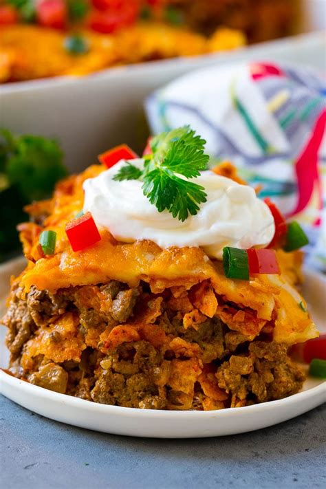 A Piece Of Dorito Casserole With Layers Of Tortilla Chips Beef And Cheese Dinner Casseroles