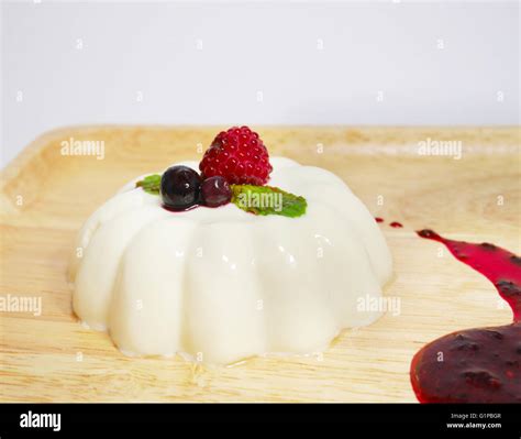 Panna Cotta With Mixed Berry Sauce Stock Photo Alamy