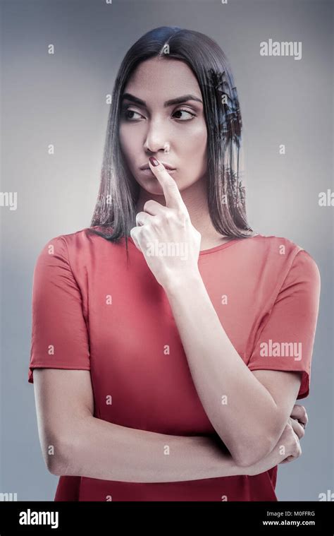 Attentive Young Woman Covering Her Mouth Stock Photo Alamy