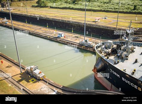 A Cargo Ship Passing Through Miraflores Locks In The Panama Canal