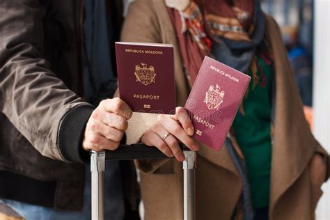 Couple Hand Holding Passport Traveler With Luggage Travel Concept