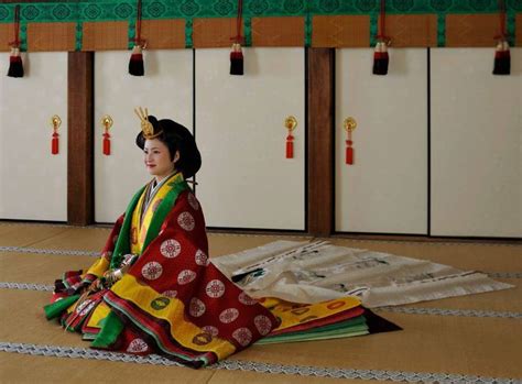 A Woman Dressed In Junihitoe At A Junihitoe Photography Experience