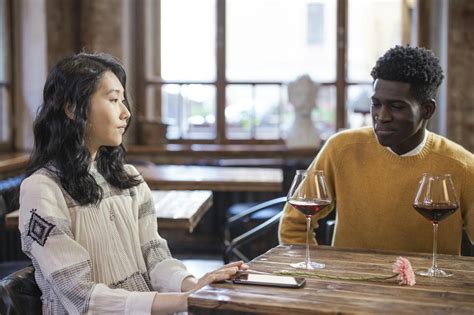 Man And Woman Sitting At Table · Free Stock Photo