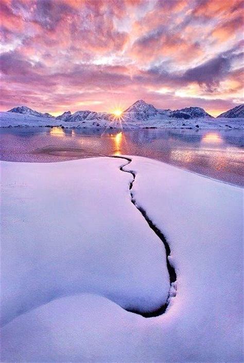 Sunset in Alaska over Snow Covered Hills