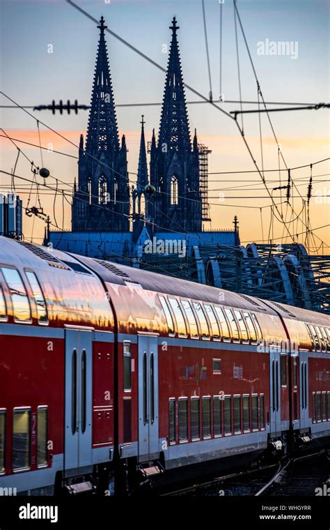 Train On The Tracks In Front Of The Hohenzollern Bridge Cologne Deutz