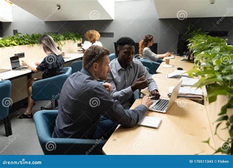 Diverse Employees Busy Cooperating In Shared Office Stock Image Image