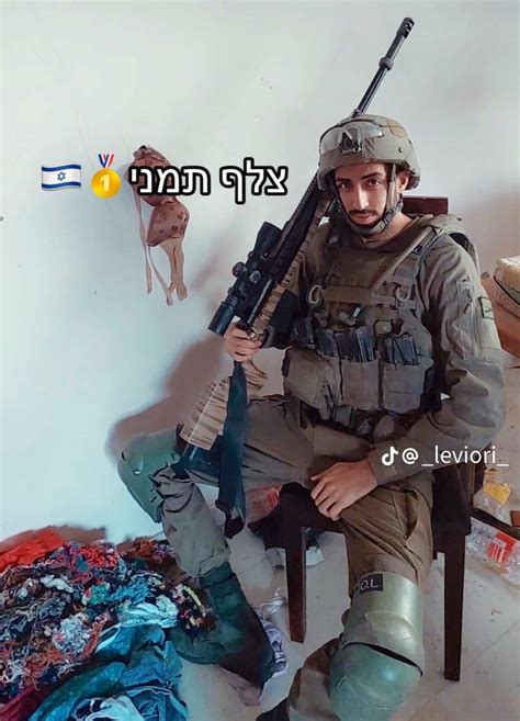 An Israeli sniper poses in an occupied Palestinian house in Gaza and ...