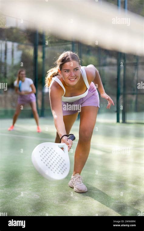 Sporty Emotional Young Woman Padel Tennis Player Trains On The Outdoor