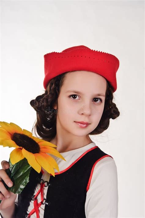 Girl In A Red Cap With A Sunflower Stock Photo Image Of Clothing