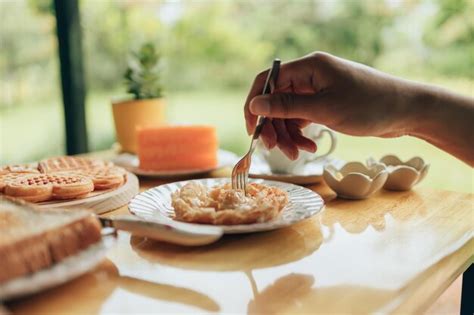 Premium Photo | Cropped image of person having breakfast