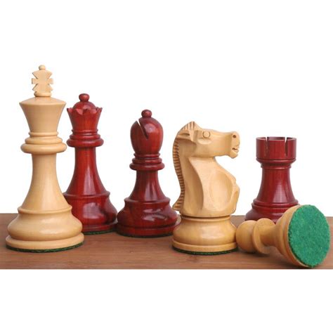 A Set Of Wooden Chess Pieces Sitting On Top Of A Table