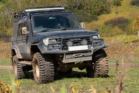 Toyota Land Cruiser Prado Off Road Expedition Truck On Autumn Forest