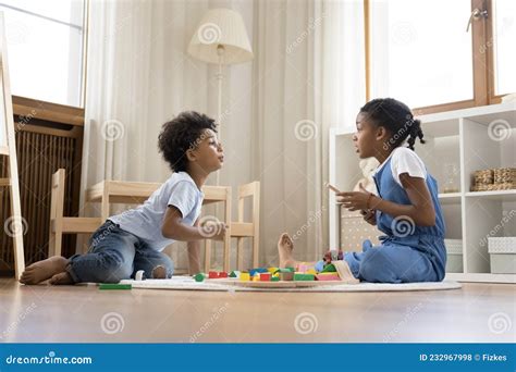 Happy Adorable African American Children Playing Toys At Home Stock