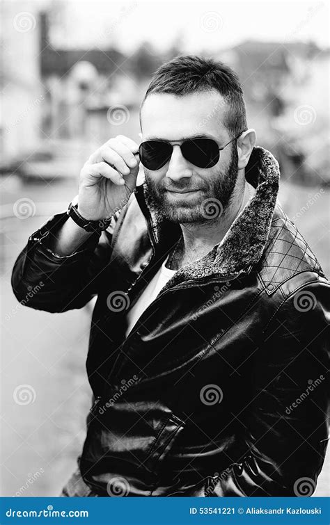 Guy With Attitude Wearing Leather Jacket And Sunglasses Out Stock Image