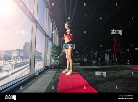 Beautiful Muscular Fit Blonde Woman Exercising Building Muscles In Gym Stock Photo Alamy