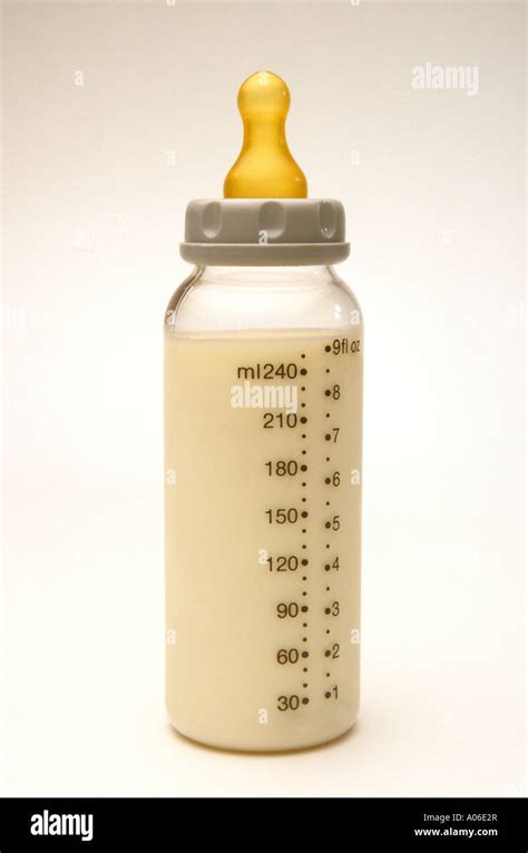 Childhood bottle full of baby milk Stock Photo - Alamy