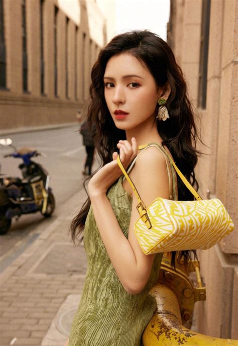 Zhang Yuxis Sexy Spring Street Photo Shoot In Green Dress Shows Her