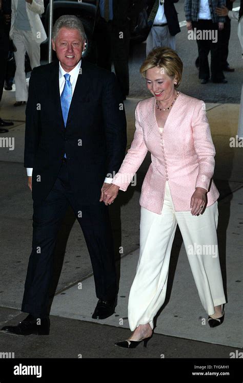 Former President Bill Clinton And His Wife Senator Hillary Clinton Pose For Pictures At The Book