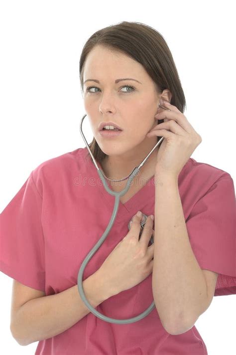 Beautiful Young Female Doctor With Stethoscope Listening To Heartbeat