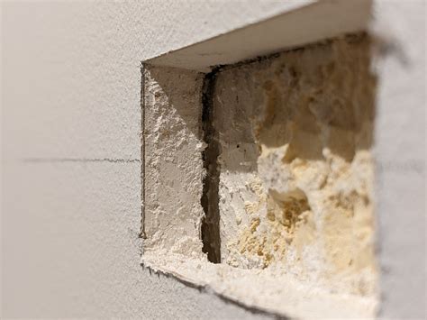 Drywall Attach Clothesline To Wall When There S Some Grainy Material Inside The Wall Home