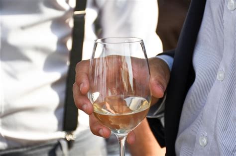 Premium Photo Man Holding A Glass Of Wine Close Up