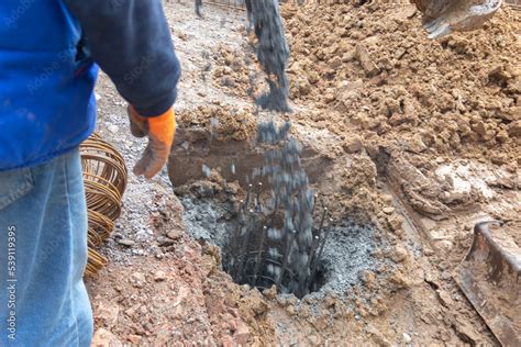 Concreting the foundation piles for the new construction site ...