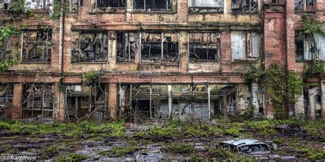 KREA An Old Decayed Factory With Holes In The Roof Where Rain Is